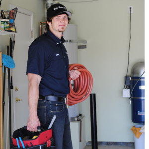 a water heater technician ready to drain a water heater 